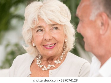 Smiling Senior Lady With Elegant Pearl Necklace