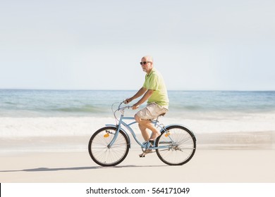 riding a bike on the beach