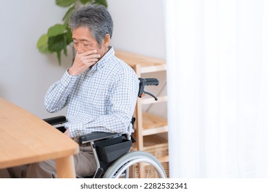 Smiling senior man in wheelchair - Shutterstock ID 2282532341