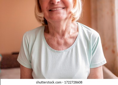 A Smiling Senior Woman With Post-operative Scar After Thyroid Surgery, Close-up, World Thyroid Day Concept