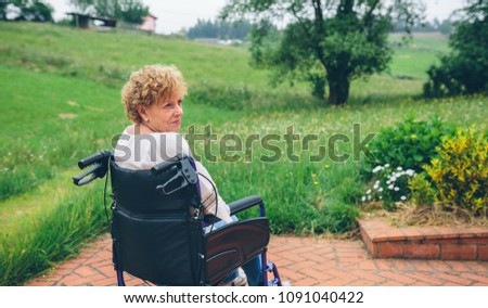 Similar – Granddaughter hugging grandmother in wheelchair