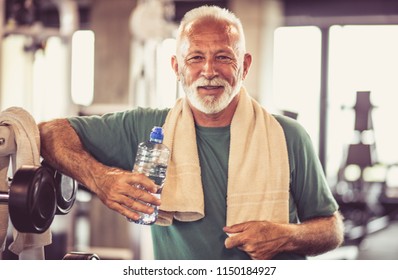 Smiling Senor Man Taking Break After Hard Exercise. Looking At Camera.