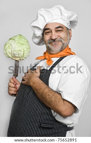 smiling shef preparing cabbage