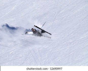 A Smiling Skier Fall On The Ski Slope.