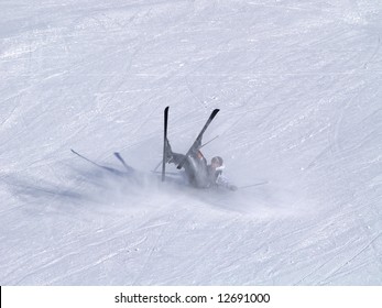 A Smiling Skier Fall On The Ski Slope.