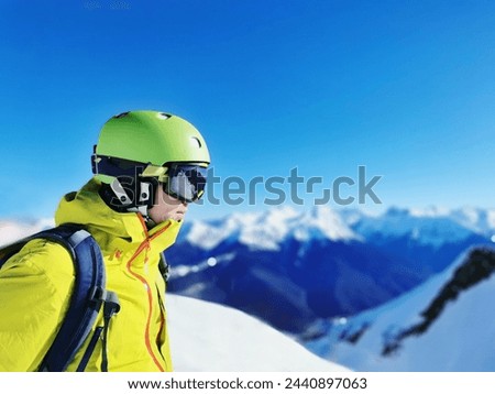 Smiling Skier with Reflective Goggles and Helmet