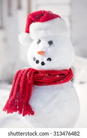 Smiling Snowman With Red Santa Hat And Scarf