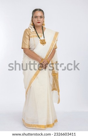 Smiling south indian senior woman in sari 