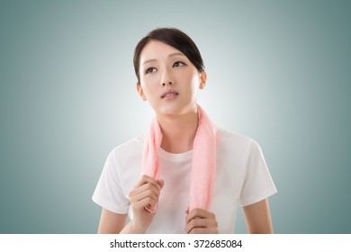 Smiling sporty asian woman take a rest after training. Closeup portrait - Shutterstock ID 372685084