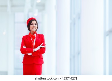 Smiling Stewardess At Airport