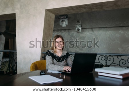 Similar – Image, Stock Photo Smiling businesswoman working at desk with laptop