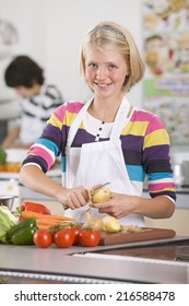 Smiling Student Preparing Recipe In Home Economics Class