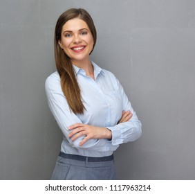 Smiling Successful Business Woman In Office Dress. Isolated Studio Portrait With Gray Wall Back.