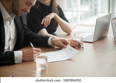 Smiling successful businessman in suit signing business contract concept, investor entrepreneur puts signature fills legal official document, customer buys insurance services, client takes bank loan