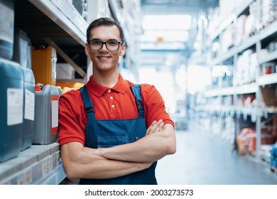 Smiling Supervisor Standing In The Sales Area Of A Hardware Store.