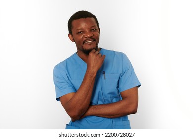 Smiling Surgeon Doctor Bearded Man In Blue Coat With Isolated On White Background. Happy Adult African American Practicing Surgeon Portrait, Confident Look