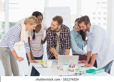 Smiling Team Of Designers Having A Meeting In Creative Office