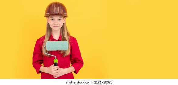 Smiling Teen Child In Builder Hard Hat With Paint Roller On Yellow Wall. Child Builder In Helmet Horizontal Poster Design. Banner Header, Copy Space.