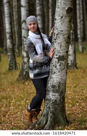 Similar – Foto Bild Herbstportrait eines glücklichen Kindes Mädchens im Garten sitzend