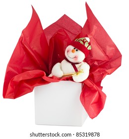 Smiling Toy Snowman In White Gift Box With Red Tissue Paper. Clipping Path.