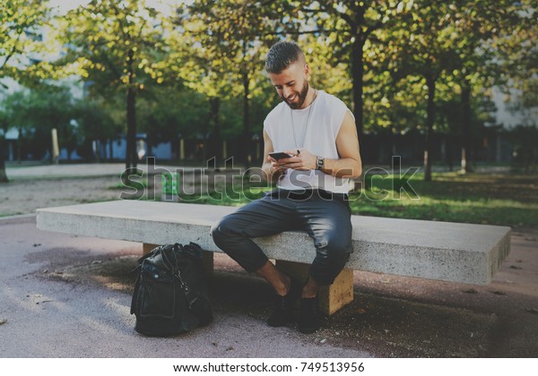 Smiling Traveler Reading Travel Guide Application Stock Photo