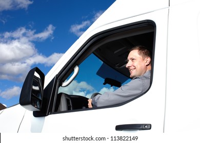 Smiling Truck Driver In The Car. Delivery Cargo Service.