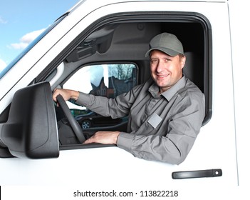 Smiling Truck Driver In The Car. Delivery Cargo Service.