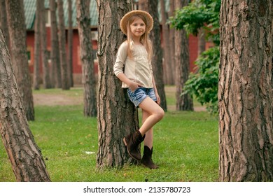 Smiling Tween Girl Leaning Against Tall Tree In Courtyard Of Country House In Summer