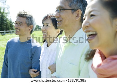 smiling two senior couples