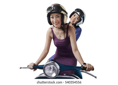 Smiling Two Young Asian Woman Riding The Scooter Isolated Over White Background