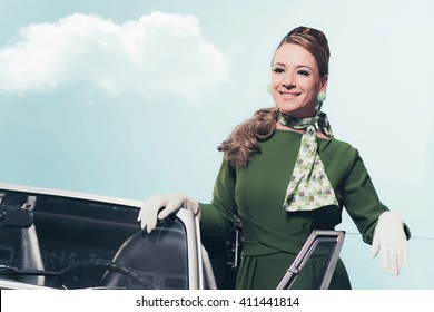 Smiling Vintage 1960 Woman Standing In Open Door Of Sports Car. 