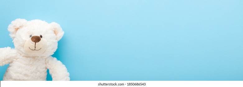 Smiling white teddy bear on light blue table background. Pastel color. Empty place for inspiration, emotional, sentimental text, quote or sayings. Closeup. Toy banner.  - Shutterstock ID 1850686543