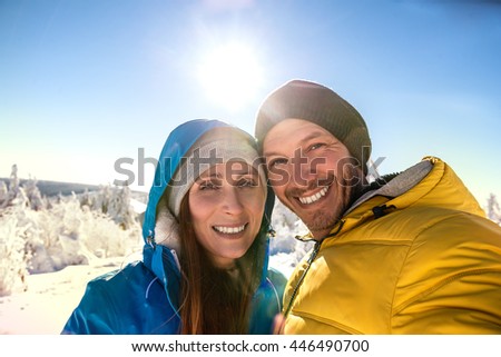 smiling wintersport selfie in the mountains
