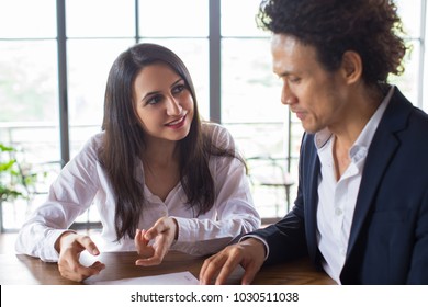 Smiling Woman Asking Business Partner For Advice