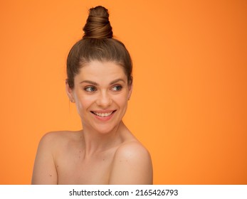 Smiling Woman With Bare Shoulders And Bun Hairstyle, Looking Back Over Shoulder, Isolated Portrait In Beauty Style, Girl Face Portrait With Natural No Retouching Skin.