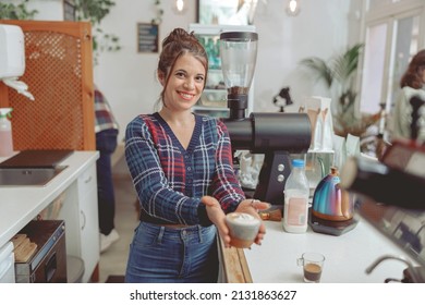 Smiling Woman Barista Holding Cup Of Cappuccino