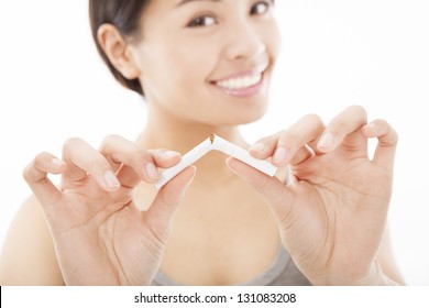 Smiling Woman Breaking Cigarette And No Smoking Concept