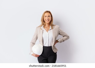  Smiling Woman Builder With A White Safety Helmet In Hand