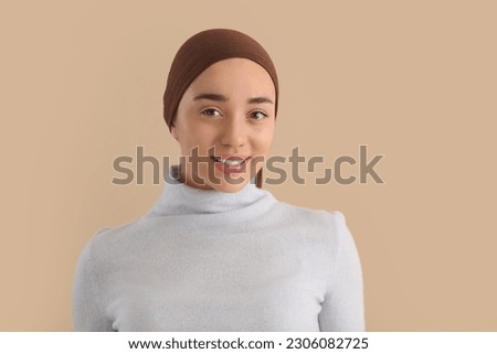 Smiling woman with cancer on beige background