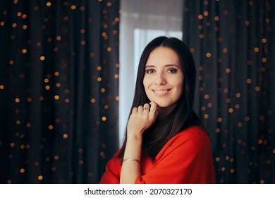 
Smiling Woman Celebrating Christmas At Home. Party Host Greeting Friendly And Hospitably
