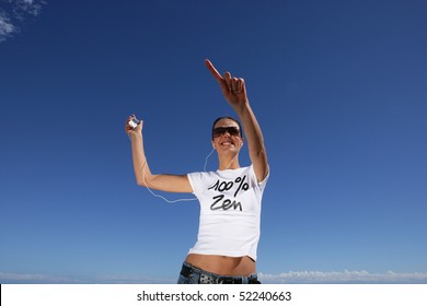 Smiling Woman Dancing With A Mp3 Walkman