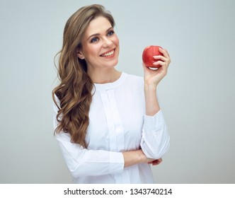 Smiling Woman Dentist Wih Healthy Teeth Holding Big Red Apple. Isolated Studio Portrait.