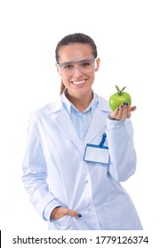 Smiling woman doctor with a green apple. Woman doctor