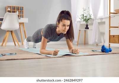 Smiling woman doing plank sport exercise, workout at home. She is engaged in fitness routine, demonstrating dedication to gym training and overall health. Providing healthy and active lifestyle. - Powered by Shutterstock