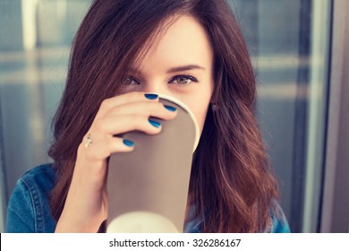 Smiling Woman Drinking Coffee Outdoors Holding Paper Cup 