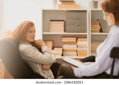 Smiling woman during consultation with holistic life coach
