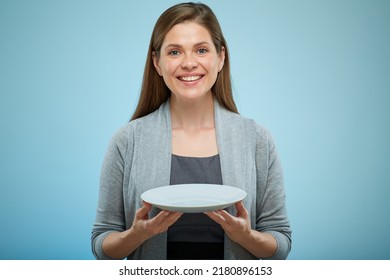 Smiling Woman Empty Plate Isolated Portrait On Light Blue Back.