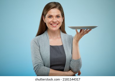 Smiling Woman Empty Plate Isolated Portrait On Light Blue Back.