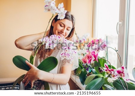 Similar – Image, Stock Photo Woman holding pink orchid