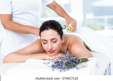 Smiling Woman Getting An Aromatherapy Treatment In A Healthy Spa